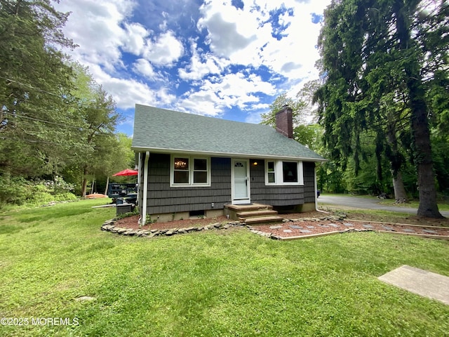 2897 State Route 138, Wall, NJ 07719 - bungalow-style house with a chimney, a front lawn, and roof with shingles