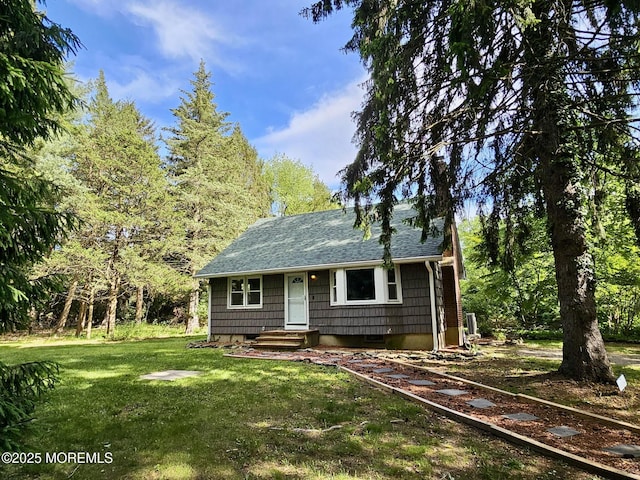 2897 State Route 138, Wall, NJ 07719 - view of front facade with a front lawn and a shingled roof
