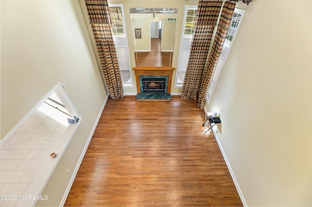 10 Emma Ln, Jackson, NJ 08527 - unfurnished living room with wood finished floors, a premium fireplace, and baseboards