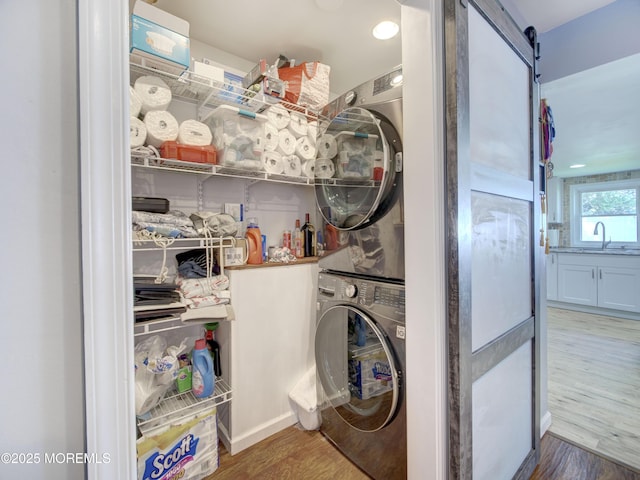 30 Mountain Ave, Hazlet, NJ 07730 - washroom featuring stacked washing machine and dryer, wood finished floors, and a barn door