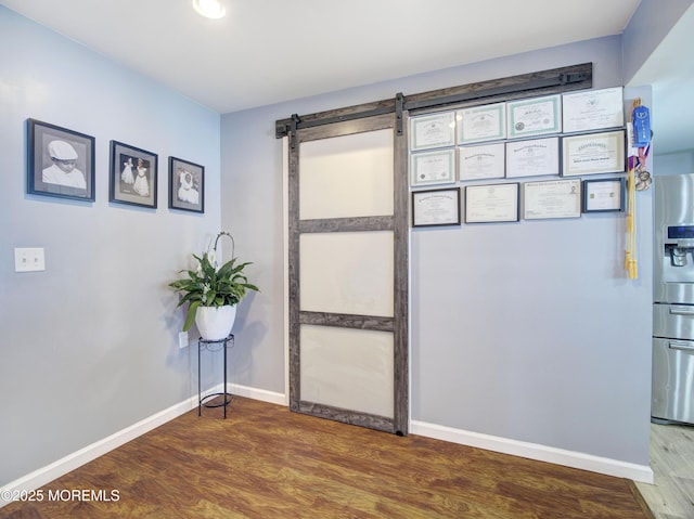 30 Mountain Ave, Hazlet, NJ 07730 - unfurnished room featuring wood finished floors, a barn door, and baseboards