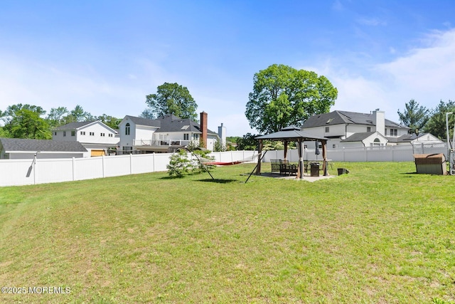 21 Wickatunk Rd, Manalapan, NJ 07726 - view of yard featuring a gazebo, a residential view, a patio area, and a storage unit