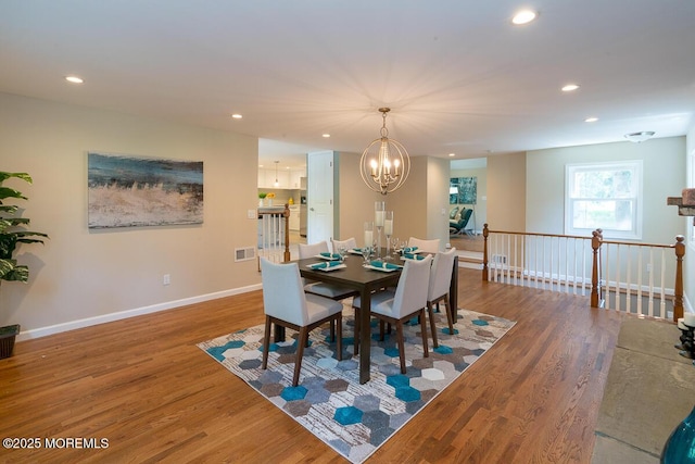 21 Wickatunk Rd, Manalapan, NJ 07726 - dining space featuring a chandelier, wood finished floors, recessed lighting, and baseboards