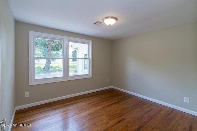 21 Wickatunk Rd, Manalapan, NJ 07726 - spare room featuring wood finished floors and baseboards