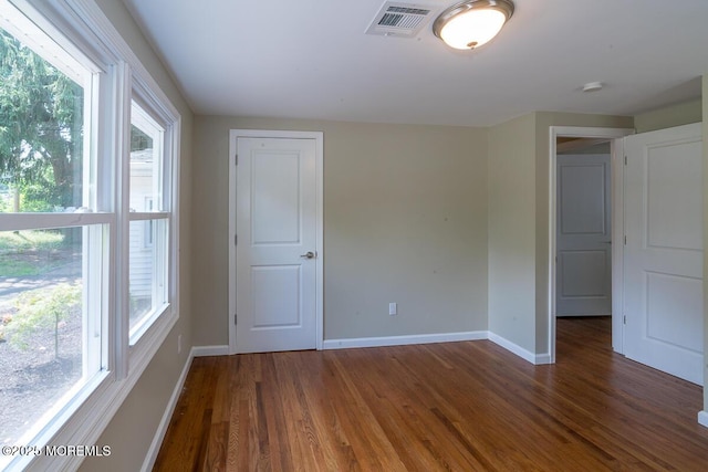 21 Wickatunk Rd, Manalapan, NJ 07726 - unfurnished room featuring baseboards and wood finished floors