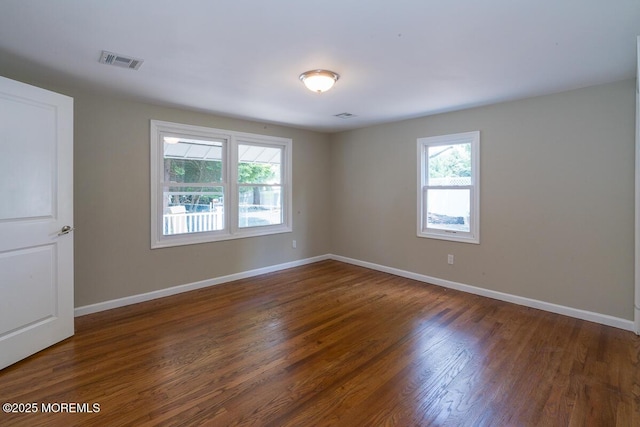 21 Wickatunk Rd, Manalapan, NJ 07726 - unfurnished room featuring dark wood-style floors and baseboards
