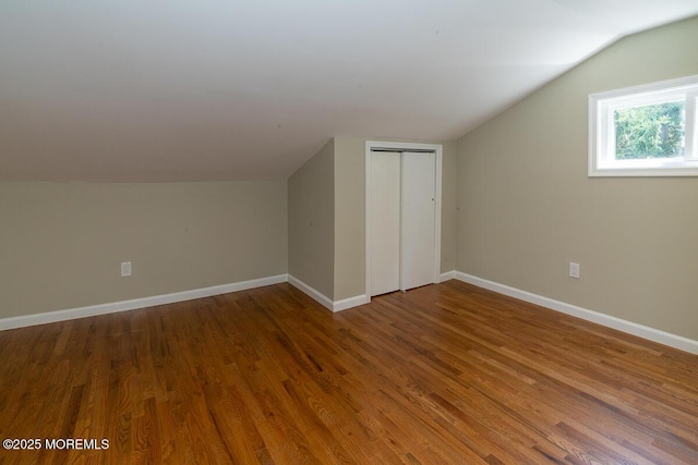 21 Wickatunk Rd, Manalapan, NJ 07726 - additional living space with lofted ceiling, wood finished floors, and baseboards