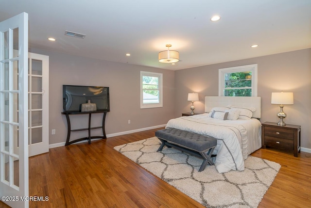 21 Wickatunk Rd, Manalapan, NJ 07726 - bedroom with wood finished floors, baseboards, and recessed lighting
