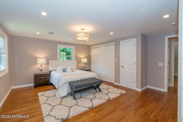 21 Wickatunk Rd, Manalapan, NJ 07726 - bedroom with baseboards, wood finished floors, recessed lighting, and multiple closets