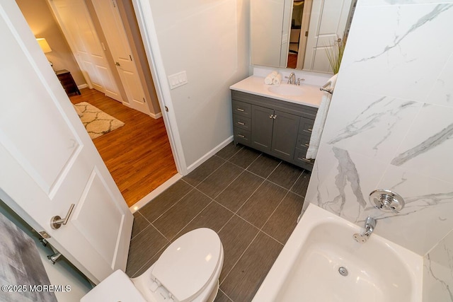 21 Wickatunk Rd, Manalapan, NJ 07726 - full bath featuring a tub, vanity, toilet, and baseboards