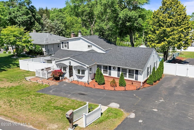 21 Wickatunk Rd, Manalapan, NJ 07726 - view of front of property featuring a gate, roof with shingles, brick siding, and driveway