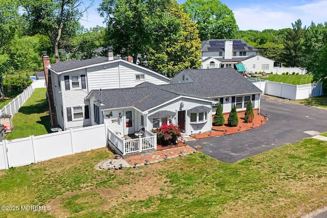 21 Wickatunk Rd, Manalapan, NJ 07726 - view of front of property with roof with shingles and a chimney