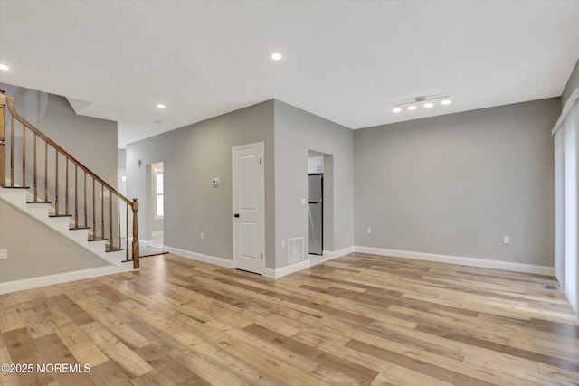1103 Creamery Ct, Freehold, NJ 07728 - empty room with stairs, light wood-type flooring, and recessed lighting