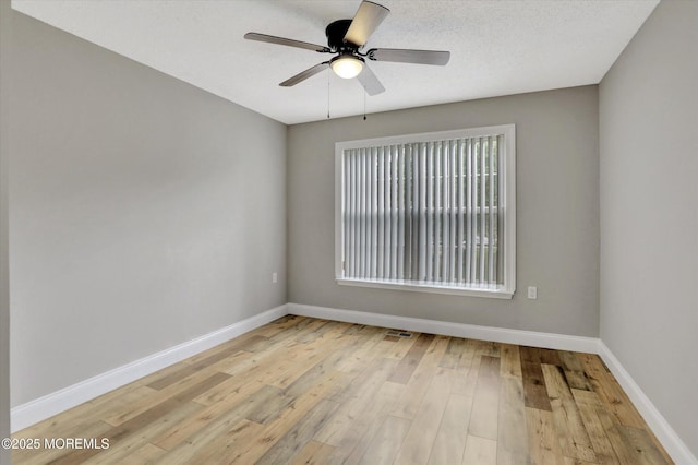 1103 Creamery Ct, Freehold, NJ 07728 - empty room featuring light wood-style floors and a ceiling fan