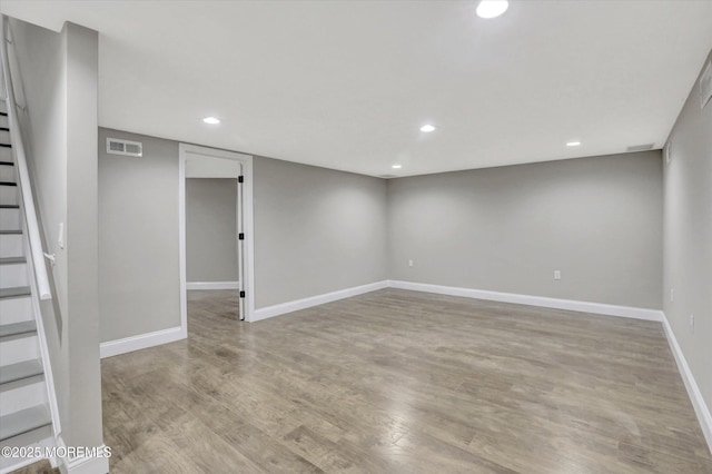 1103 Creamery Ct, Freehold, NJ 07728 - finished below grade area with stairs, recessed lighting, and wood finished floors