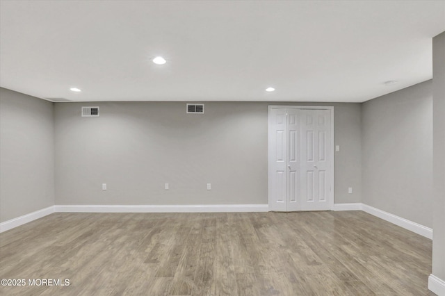 1103 Creamery Ct, Freehold, NJ 07728 - finished basement with light wood finished floors and recessed lighting
