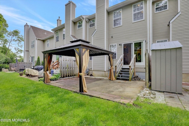 1103 Creamery Ct, Freehold, NJ 07728 - back of house with a gazebo, a yard, a patio, entry steps, and a chimney