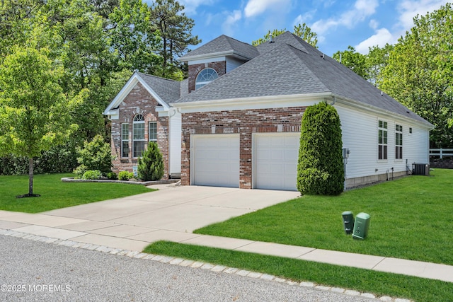 24 Beach Haven Way, Waretown, NJ 08758 - traditional home with a shingled roof, an attached garage, driveway, a front yard, and brick siding