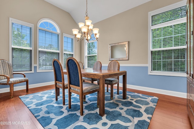 24 Beach Haven Way, Waretown, NJ 08758 - dining room featuring a chandelier, healthy amount of natural light, wood finished floors, baseboards, and vaulted ceiling