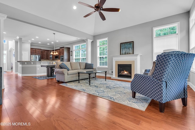 24 Beach Haven Way, Waretown, NJ 08758 - living area featuring a ceiling fan, recessed lighting, wood finished floors, a glass covered fireplace, and decorative columns