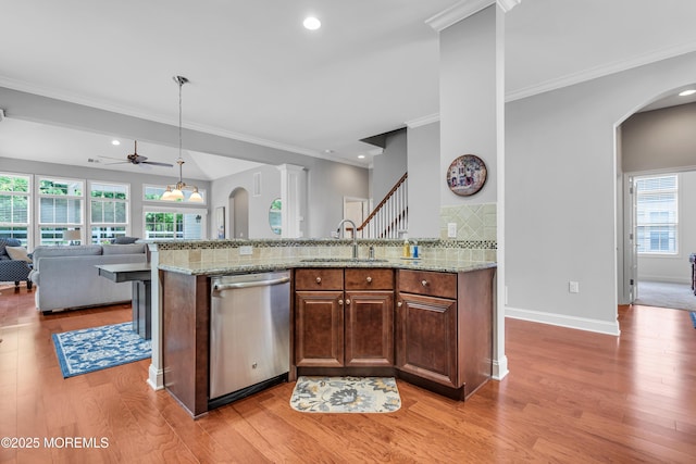 24 Beach Haven Way, Waretown, NJ 08758 - kitchen with dishwasher, a sink, open floor plan, ceiling fan, and arched walkways
