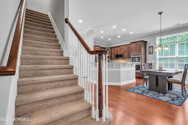 24 Beach Haven Way, Waretown, NJ 08758 - stairs with crown molding, recessed lighting, wood finished floors, and baseboards