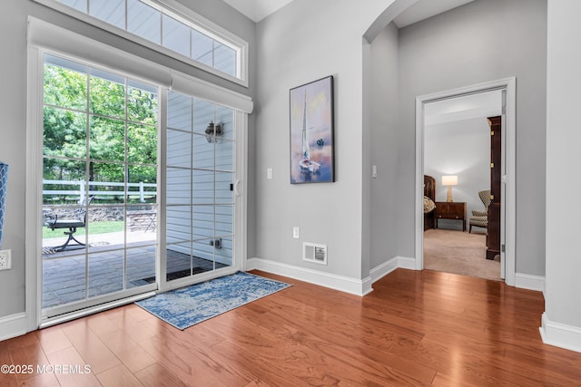 24 Beach Haven Way, Waretown, NJ 08758 - entryway with wood finished floors, baseboards, and arched walkways