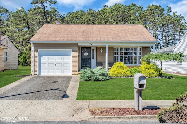 184 Pulaski Blvd, Toms River, NJ 08757 - view of front of property featuring a garage, asphalt driveway, covered porch, a front lawn, and a chimney
