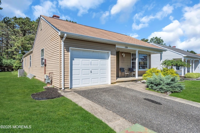 184 Pulaski Blvd, Toms River, NJ 08757 - ranch-style home with a porch, a garage, a front yard, and asphalt driveway
