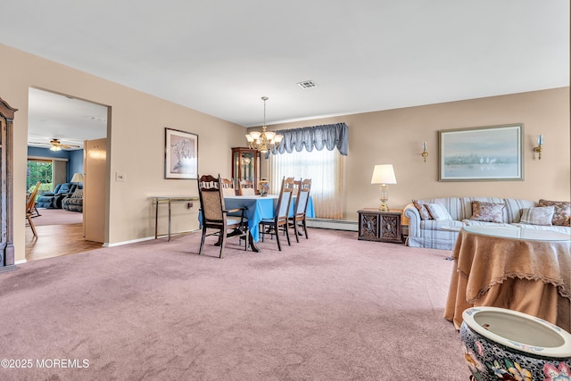184 Pulaski Blvd, Toms River, NJ 08757 - carpeted dining room with a chandelier, a baseboard heating unit, baseboards, and a ceiling fan