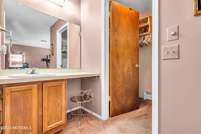 184 Pulaski Blvd, Toms River, NJ 08757 - bathroom with a baseboard heating unit, vanity, and a closet