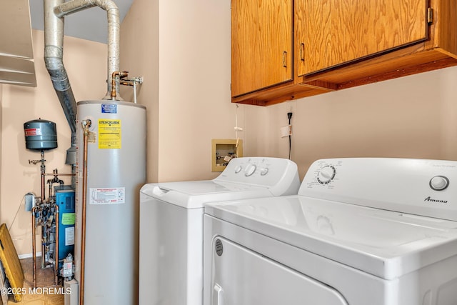 184 Pulaski Blvd, Toms River, NJ 08757 - washroom featuring water heater, washer and clothes dryer, and cabinet space