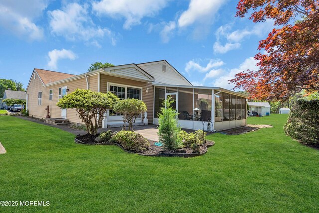 184 Pulaski Blvd, Toms River, NJ 08757 - back of property featuring a sunroom and a yard