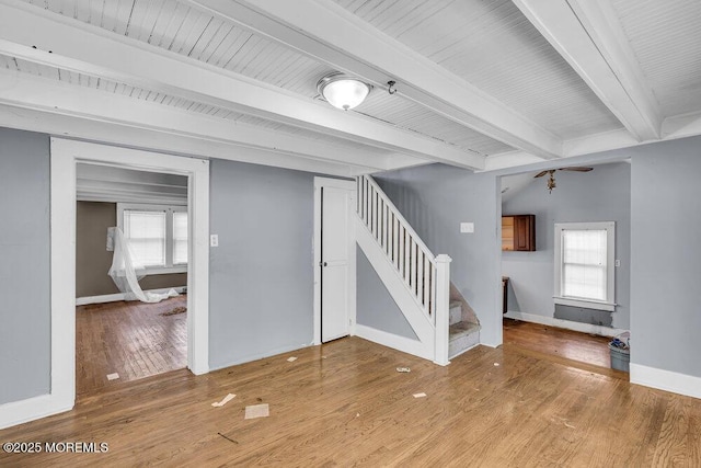 93 Lawrence Ave, Keansburg, NJ 07734 - empty room featuring stairway, beamed ceiling, plenty of natural light, wood finished floors, and baseboards