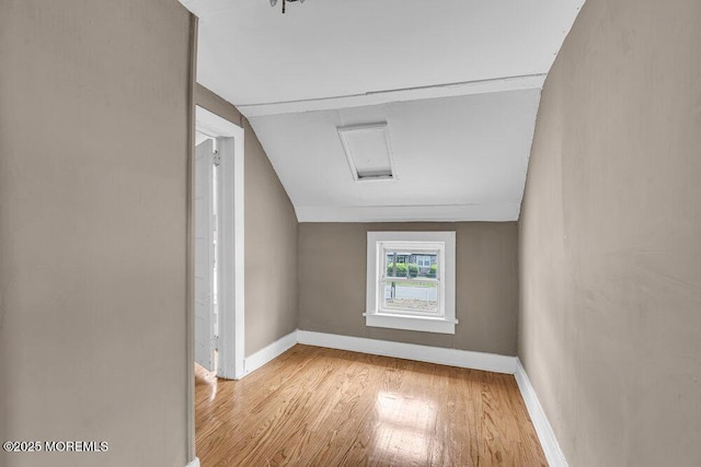 93 Lawrence Ave, Keansburg, NJ 07734 - empty room with wood finished floors, baseboards, attic access, and vaulted ceiling