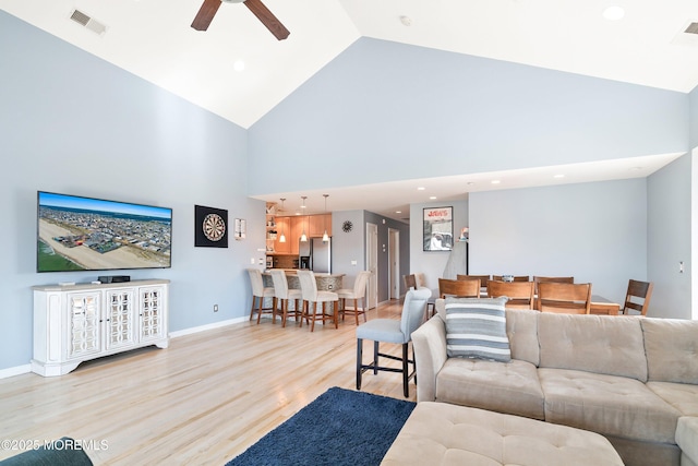 18 Sheridan Ave Unit 3, Seaside Heights, NJ 08751 - living room with high vaulted ceiling, light wood-type flooring, a ceiling fan, recessed lighting, and baseboards