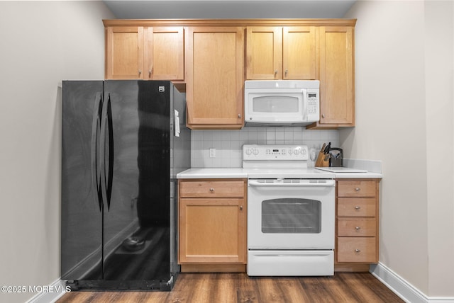 100 Middlesex Blvd Unit 144, Plainsboro, NJ 08536 - kitchen featuring white appliances, light countertops, dark wood finished floors, backsplash, and baseboards