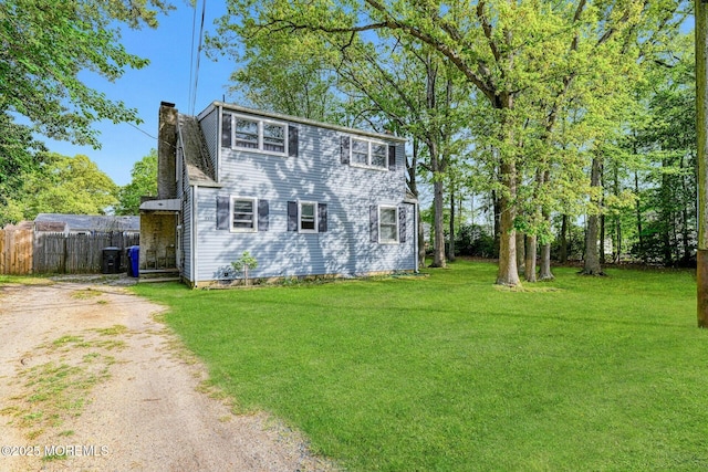 33 Cumberland Dr, Brick, NJ 08723 - view of side of home with a chimney and driveway