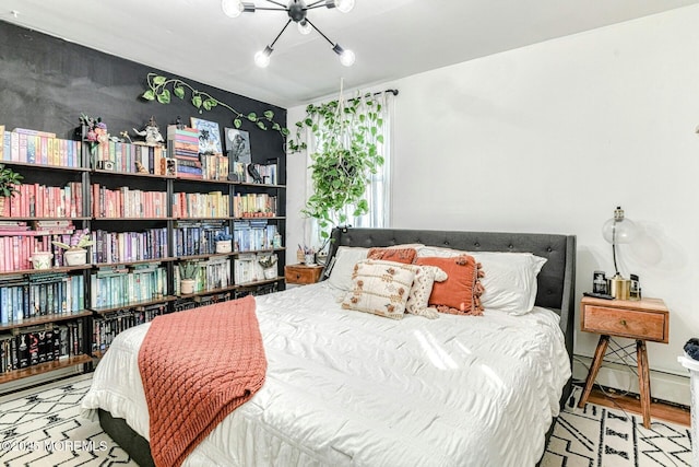 33 Cumberland Dr, Brick, NJ 08723 - bedroom with a baseboard heating unit, a chandelier, and wood finished floors