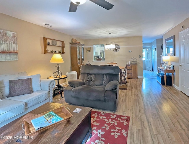 69 Bradford Ct, Aberdeen, NJ 07747 - living area with ceiling fan, wood finished floors, and baseboards