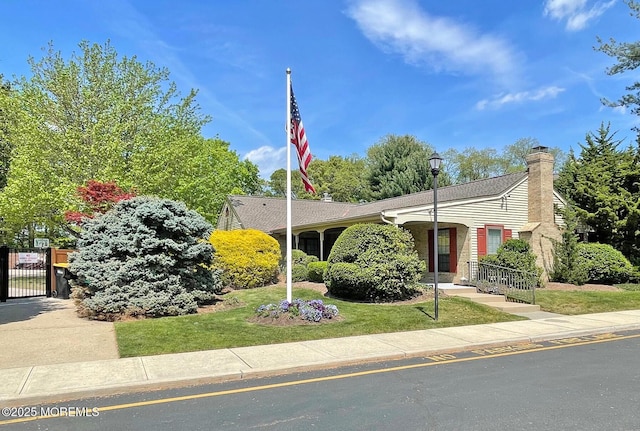 69 Bradford Ct, Aberdeen, NJ 07747 - view of front of property featuring a gate, a front yard, a chimney, and a shingled roof