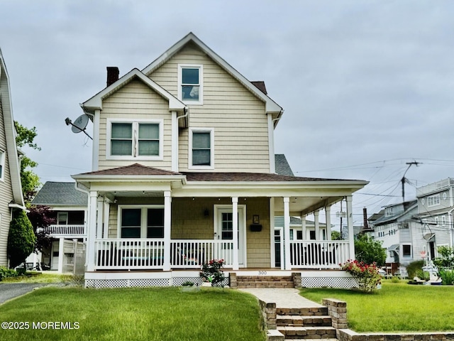300 Lareine Ave, Bradley Beach, NJ 07720 - view of front of house with a porch, a chimney, a front yard, and roof with shingles