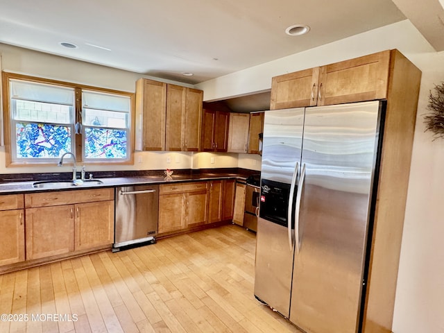 300 Lareine Ave, Bradley Beach, NJ 07720 - kitchen with appliances with stainless steel finishes, dark countertops, light wood finished floors, recessed lighting, and brown cabinetry