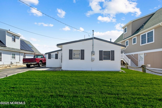131 S Commodore Dr, Little Egg Harbor, NJ 08087 - rear view of house with a yard and stairway