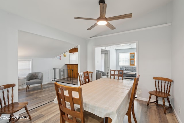 131 S Commodore Dr, Little Egg Harbor, NJ 08087 - dining room with lofted ceiling, light wood-style floors, ceiling fan, and baseboards