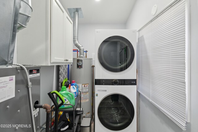 131 S Commodore Dr, Little Egg Harbor, NJ 08087 - laundry room featuring estacked washer and dryer, cabinet space, and water heater