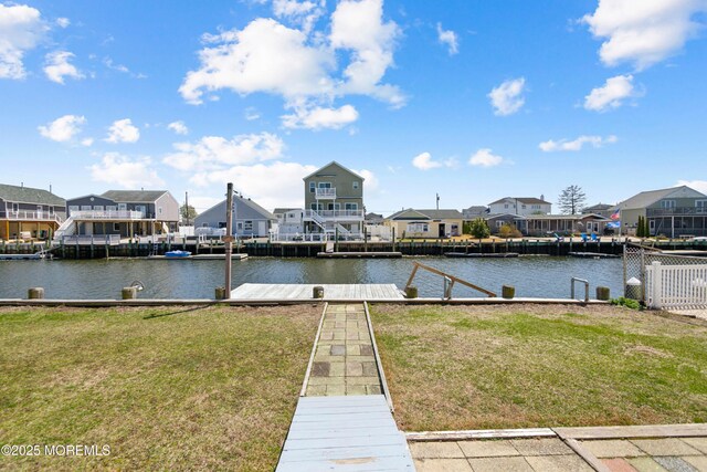 131 S Commodore Dr, Little Egg Harbor, NJ 08087 - dock with a residential view, a lawn, and a water view