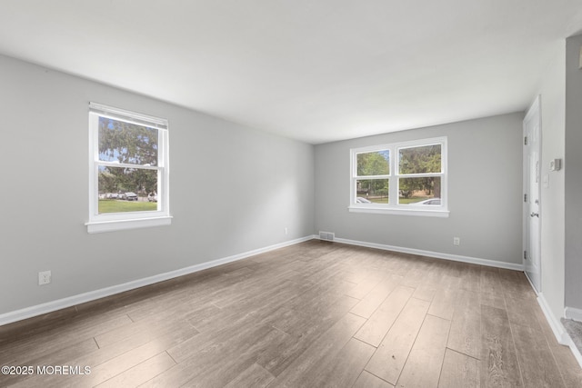 317 Bath Ave Unit 2, Long Branch, NJ 07740 - spare room featuring healthy amount of natural light, wood finished floors, and baseboards