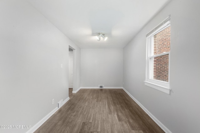 317 Bath Ave Unit 2, Long Branch, NJ 07740 - spare room featuring dark wood finished floors, baseboards, and plenty of natural light