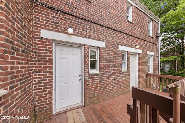 317 Bath Ave Unit 2, Long Branch, NJ 07740 - view of exterior entry featuring a wooden deck and brick siding